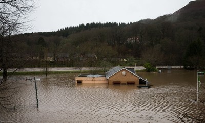 160220 -  The nursery and bowls club alongside the River Taff at Taffs Well north of Cardiff in south Wales are submerged as the the river bursts it's banks from the effects of storm Dennis