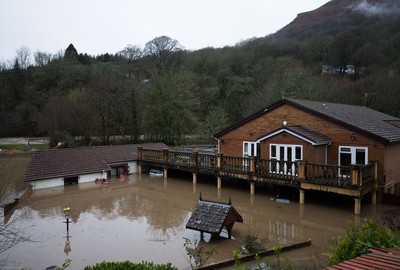 160220 -  Homes alongside the River Taff at Taffs Well north of Cardiff in south Wales are submerged as the the river bursts it's banks from the effects of storm Dennis