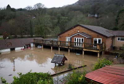 160220 -  Homes alongside the River Taff at Taffs Well north of Cardiff in south Wales are submerged as the the river bursts it's banks from the effects of storm Dennis