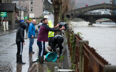 160220 -  Residents on Sion Street in Pontypridd begin to clear up after their homes were flooded after the River Taff bursts it's banks from the effects of storm Dennis