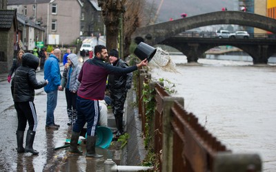 160220 -  Residents on Sion Street in Pontypridd begin to clear up after their homes were flooded after the River Taff bursts it's banks from the effects of storm Dennis