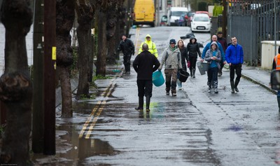 160220 -  Residents on Sion Street in Pontypridd begin to clear up after their homes were flooded after the River Taff bursts it's banks from the effects of storm Dennis