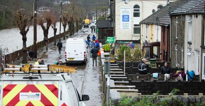 160220 -  Residents on Sion Street in Pontypridd begin to clear up after their homes were flooded after the River Taff bursts it's banks from the effects of storm Dennis