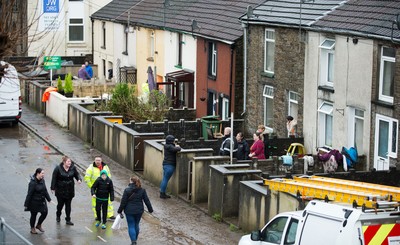 160220 -  Residents on Sion Street in Pontypridd begin to clear up after their homes were flooded after the River Taff bursts it's banks from the effects of storm Dennis