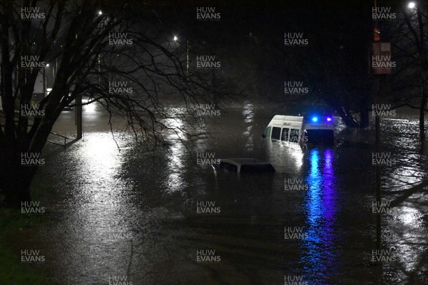 160220 - South Wales Flooding during Storm Dennis - A ambulance is surrounded by flood water in Nantgarw, South Wales
