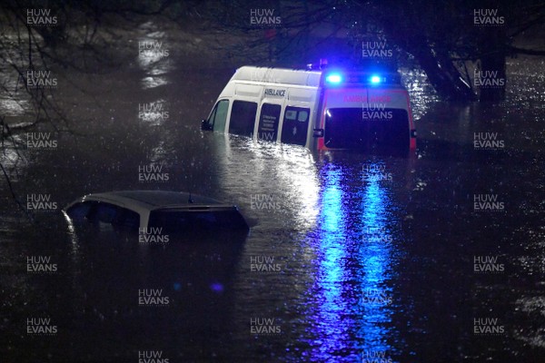160220 - South Wales Flooding during Storm Dennis - A ambulance is surrounded by flood water in Nantgarw, South Wales