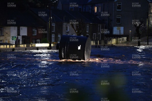 160220 - South Wales Flooding during Storm Dennis - A tank flows through flood water in Pontypridd, South Wales