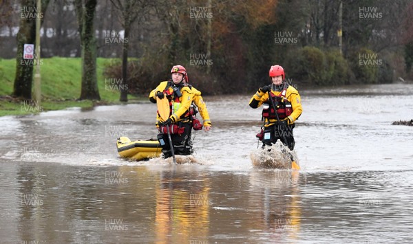 160220 - South Wales Flooding during Storm Dennis - Rescuers search flood water in Upper Boat, South Wales