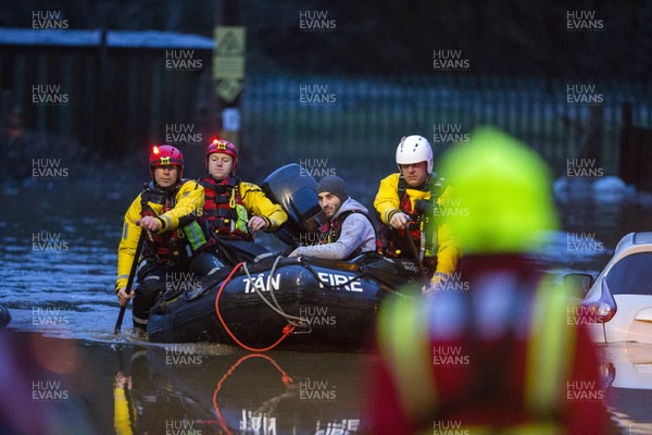 160220 - Picture shows people being rescued from Egypt Street, Pontypridd, Near Cardiff which has flooded in nearby streets and homes