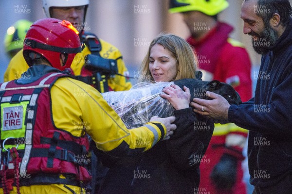 160220 - Picture shows a women being reunited with her dog after being rescued from Egypt Street, Pontypridd, Near Cardiff which has flooded in nearby streets and homes