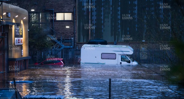 160220 -  Vehicles are submerged at the Royal Mail sorting office and other industrial units at Taffs Well north of Cardiff in south Wales are flooded as the River Taff bursts it's banks from the effects of storm Dennis