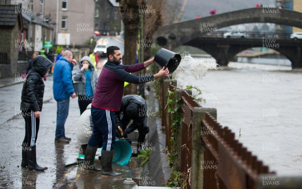 160220 -  Residents on Sion Street in Pontypridd begin to clear up after their homes were flooded after the River Taff bursts it's banks from the effects of storm Dennis