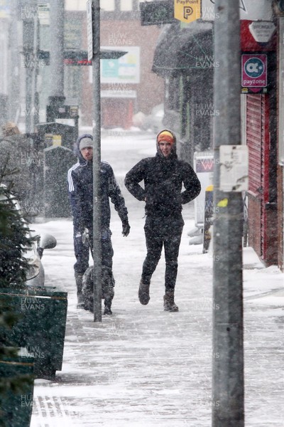 010318 - Storm Emma South Wales - Locals in Llandaff North brave the elements as the winter weather takes hold
