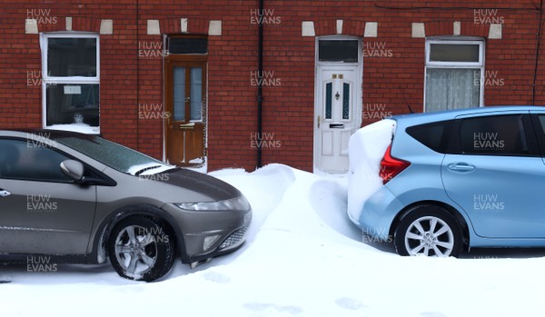 020318 - Weather - Cars surrounded by deep snow in Penarth near Cardiff, South Wales after being hit by Storm Emma
