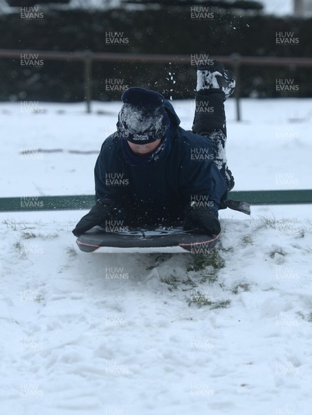 020318 - Weather - A child sledges in Penarth near Cardiff, South Wales after being hit by Storm Emma
