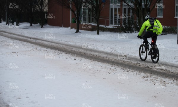 020318 - Storm Emma, Cardiff - A cyclist makes her their down one of the usually busy rush hour main roads in Cardiff city centre this morning after storm Emma hits south Wales and the South West, forcing many to stay at home