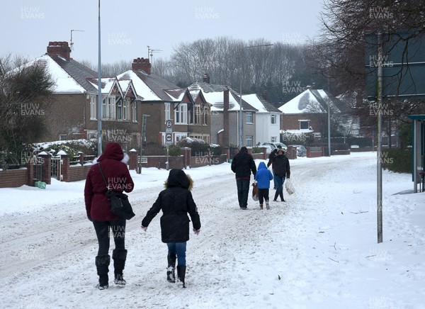 020318 - Storm Emma, Cardiff -  Shoppers make their way through the snow in Llanishen, Cardiff