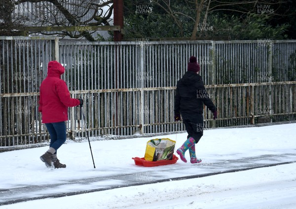 020318 - Storm Emma, Cardiff -  Shoppers make their way through the snow in Llanishen, Cardiff