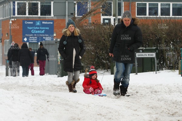 020318 - Storm Emma hits Cardiff - Residents in Llandaff North struggle through the snow as storm Emma takes hold  