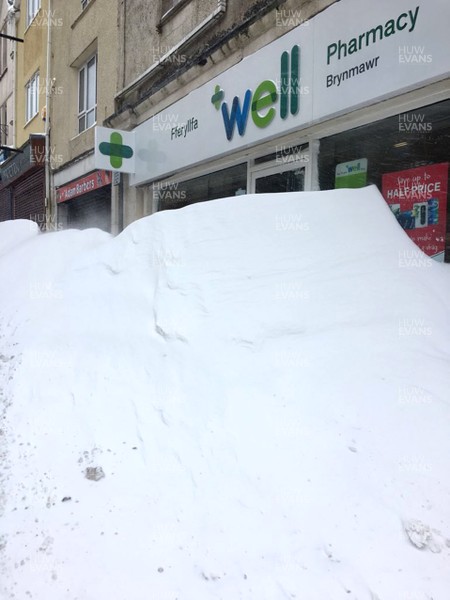 030318 - Weather - Shop fronts blocked by snow drifts in Brynmawr, South Wales after being hit by Storm Emma