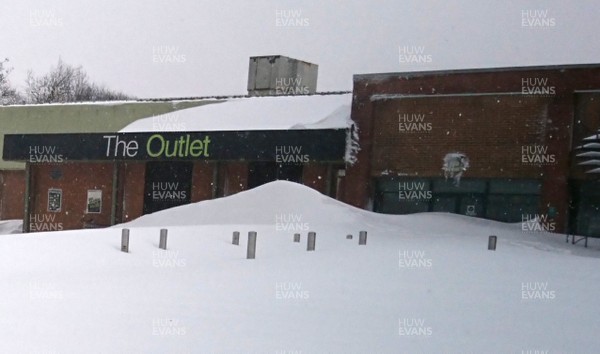 030318 - Weather - Shop fronts blocked by snow drifts in Ebbw Vale, South Wales after being hit by Storm Emma