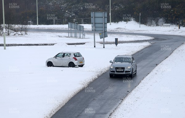 030318 - Picture shows a stranded car as the snow still causing problems on the roads in Pontypridd, South Wales