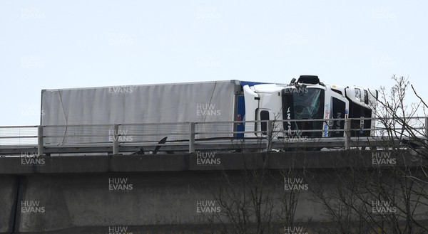 180222 - Strom Eunice - The scene where two lorries which have been blown over on the M4 motorway between Pyle and Margam, South Wales during Storm Eunice