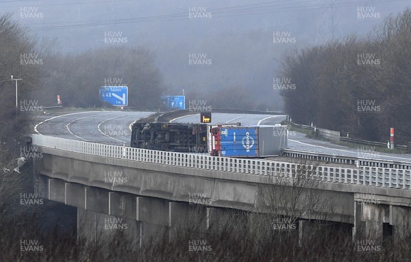 180222 - Strom Eunice - The scene where two lorries which have been blown over on the M4 motorway between Pyle and Margam, South Wales during Storm Eunice