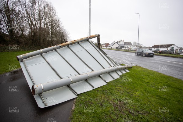 180222 - Picture shows a road sign which has blown over in the high winds at Barry, South Wales during Storm Eunice today, as the region has been issued with a rare red weather warming