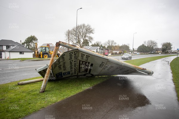 180222 - Picture shows a road sign which has blown over in the high winds at Barry, South Wales during Storm Eunice today, as the region has been issued with a rare red weather warming