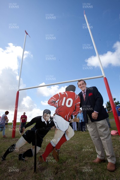 030813 - Unveiling of Stradey Park rugby posts and statue at  Sandy Park, Llanelli - Llanelli RFC legend Phil Bennett with the statue depicting him playing against the All Blacks at the newly located rugby posts from Llanelli's old Stradey Park at Sandy Park on the Millennium Coastal Path