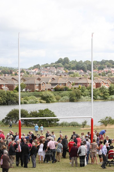 030813 - Unveiling of Stradey Park rugby posts and statue at  Sandy Park, Llanelli - Crowds gather to watch the unveiling of the statue at the newly located rugby posts from Llanelli's old Stradey Park at Sandy Park on the Millennium Coastal Path