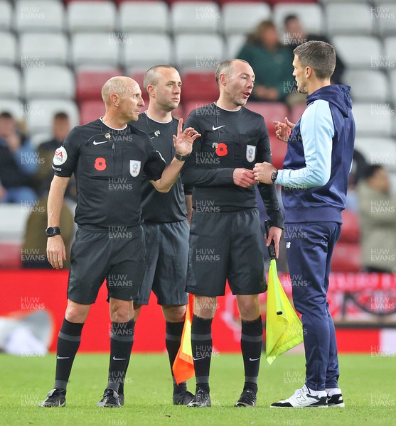 051122 - Sunderland v Cardiff City - Sky Bet Championship - Manager Mark Hudson of Cardiff has a long chat with the match officials at the end of the match