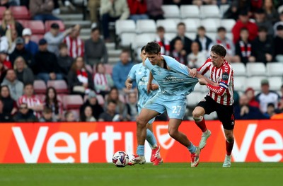 080325 - Sunderland v Cardiff City - Sky Bet Championship - Dan Neil of Sunderland and Rubin Colwill of Cardiff City