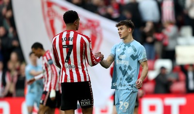 080325 - Sunderland v Cardiff City - Sky Bet Championship - Players shake hands at the final whistle