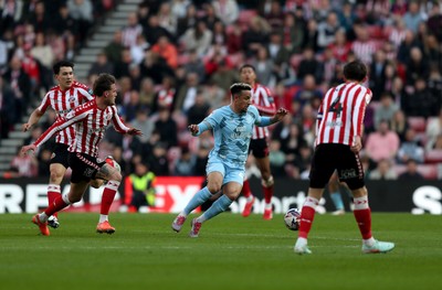 080325 - Sunderland v Cardiff City - Sky Bet Championship - Leo Fuhr Hjelde of Sunderland and Callum Robinson of Cardiff City