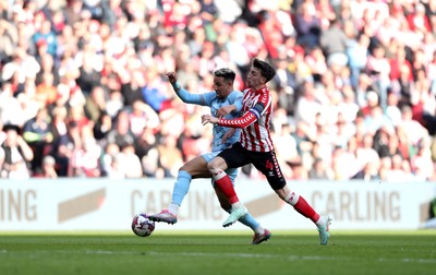 080325 - Sunderland v Cardiff City - Sky Bet Championship - Dan Neil of Sunderland and Callum Robinson of Cardiff City