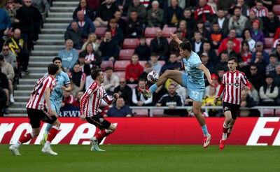 080325 - Sunderland v Cardiff City - Sky Bet Championship - Dan Neil of Sunderland and Rubin Colwill of Cardiff City