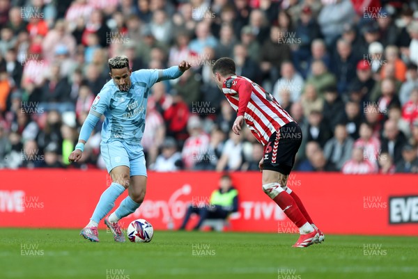 080325 - Sunderland v Cardiff City - Sky Bet Championship - Chris Mepham of Sunderland and Callum Robinson of Cardiff City