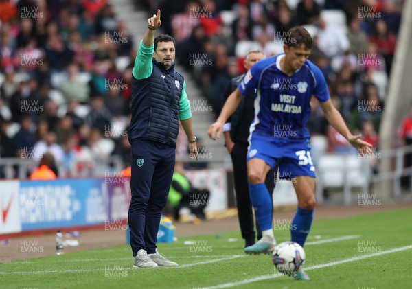 240923 - Sunderland v Cardiff City - Sky Bet Championship - Manager Erol Bulut of Cardiff watches play from the technical area and seems to be giving directions to Perry Ng of Cardiff
