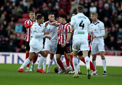 140123 - Sunderland v Swansea City - Sky Bet Championship - Players come together after a challenge by Luke O'Nien of Sunderland who is then sent off