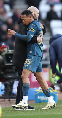 240224 - Sunderland v Swansea City - Sky Bet Championship - Ronald of Swansea comes off in the 2nd half to be hugged by Head Coach Luke Williams  of Swansea