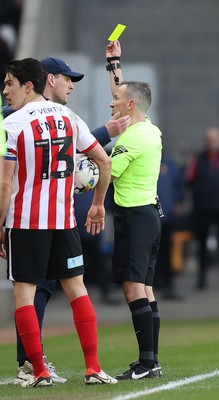 240224 - Sunderland v Swansea City - Sky Bet Championship - Manager Mike Dodds of Sunderland AFC is given a yellow card for encroaching onto the playing surface by referee Keith Stroud