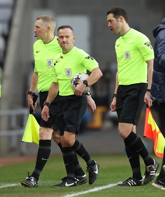 240224 - Sunderland v Swansea City - Sky Bet Championship - Referee Keith Stroud and assistants leave the pitch to boos from the crowd