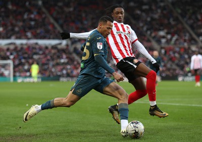 240224 - Sunderland v Swansea City - Sky Bet Championship - Ronald of Swansea and Romaine Mundle of Sunderland AFC