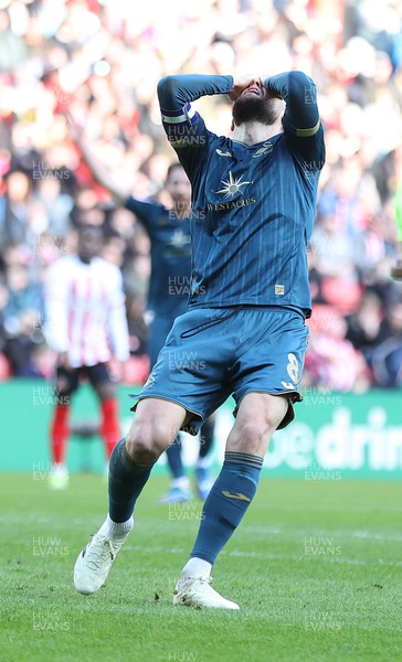 240224 - Sunderland v Swansea City - Sky Bet Championship - Matt Grimes of Swansea reacts to missing an open goal
