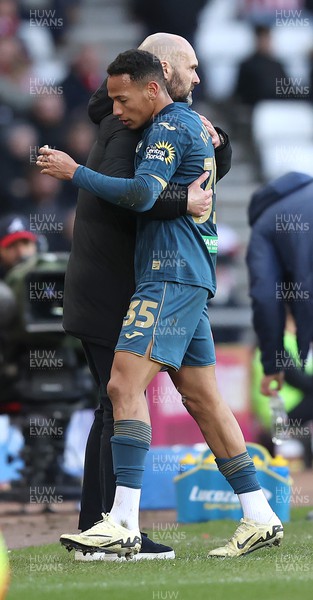 240224 - Sunderland v Swansea City - Sky Bet Championship - Ronald of Swansea comes off in the 2nd half to be hugged by Head Coach Luke Williams  of Swansea