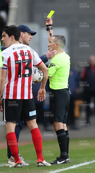 240224 - Sunderland v Swansea City - Sky Bet Championship - Manager Mike Dodds of Sunderland AFC is given a yellow card for encroaching onto the playing surface by referee Keith Stroud