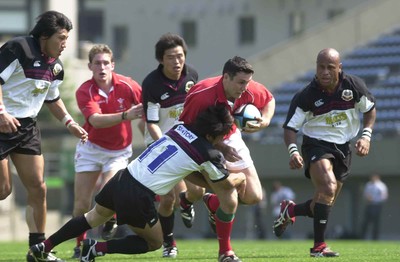 030601 - Suntory v Wales - Stephen Jones is caught by Toru Kurihara