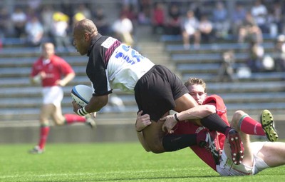 030601 - Suntory v Wales - Jamie Robinson gets to grips with Alfred Uluinayau